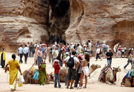 Tourists in the Bab as Siq valley in the Temple city of Petra in Jordan in the middle east.のeditorial素材
