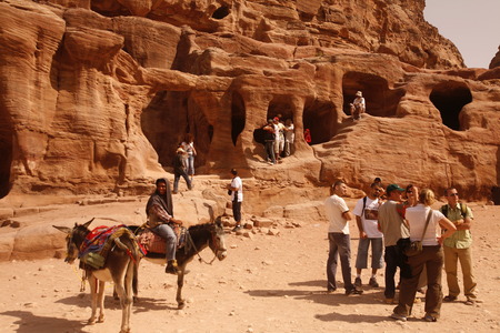 Tourists in the Bab as Siq valley in the Temple city of Petra in Jordan in the middle east.のeditorial素材