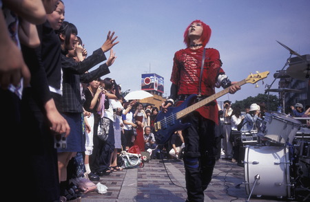 a Japanese Youth punk band plays on a square in the City of Tokyo in Japan in Asia,のeditorial素材