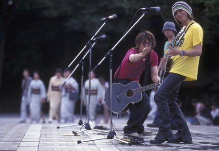 a Japanese Youth punk band plays on a square in the City of Tokyo in Japan in Asia,のeditorial素材