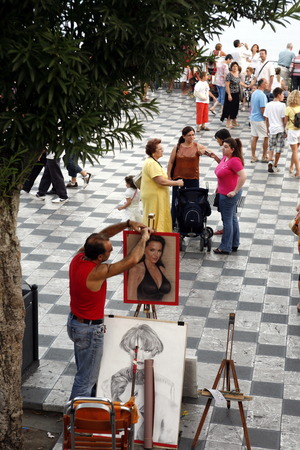 a Painter in the old Town of Taormina in Sicily in south Italy in Europe.のeditorial素材