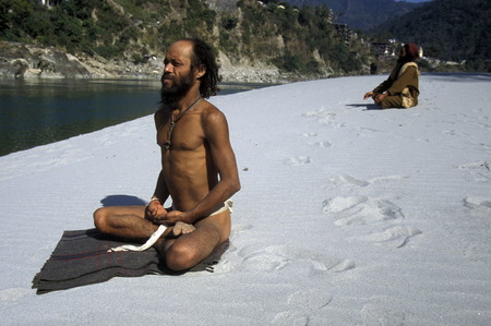 two men on the Ganges River in the town of Rishikesh in the Province Uttar Pradesh in India.のeditorial素材