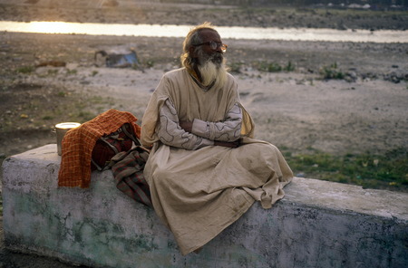 a men on the Ganges River in the town of Rishikesh in the Province Uttar Pradesh in India.のeditorial素材