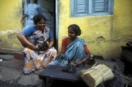women at a factory of  Incense Sticks in the city of Mysore in the province Karnataka in India.のeditorial素材