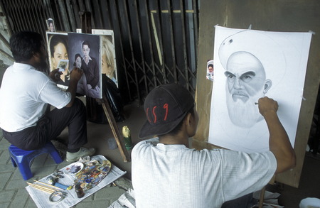artist painter at working in a shop in the city centre of Jakarta in Indonesia in Southeastasia.のeditorial素材