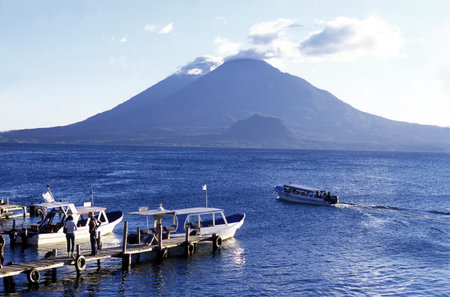 The Lake Atitlan mit the Volcanos of Toliman and San Pedro in the back at the Town of Panajachel in Guatemala in central America.のeditorial素材