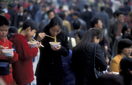 People at the main square in the city of Chongqing in the province of Sichuan in China in east asia.のeditorial素材