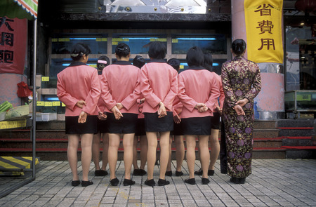 restaraurant the staff of a fish restaurant in the city of Shenzhen north of Hong Kong in the province of Guangdong in China in east asia.のeditorial素材