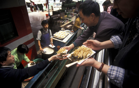 fast food at the harbor in the village of Badong on the yangzee river in the three gorges valley up of the three gorges dam projecz in the province of hubei in china.のeditorial素材