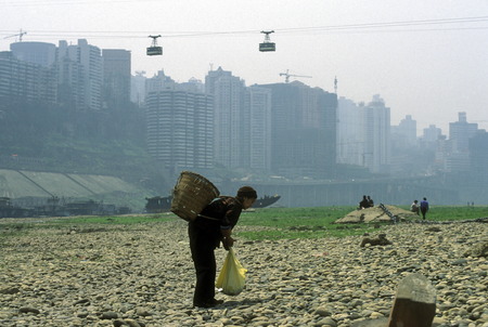 the cable car on the way over the yangzee River in the city of Chongqing in the province of Sichuan in China in east asia.のeditorial素材