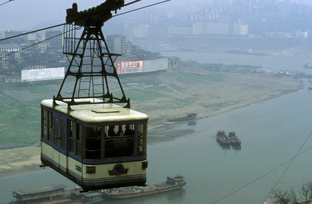 the cable car on the way over the yangzee River in the city of Chongqing in the province of Sichuan in China in east asia.のeditorial素材