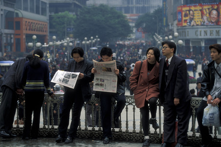 people at the main square in the city of Chongqing in the province of Sichuan in China in east asia.のeditorial素材