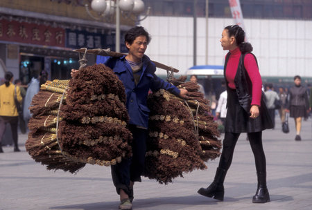 Transport people at the main square in the city of Chongqing in the province of Sichuan in China in east asia.のeditorial素材