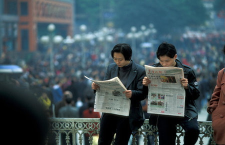 people at the main square in the city of Chongqing in the province of Sichuan in China in east asia.のeditorial素材