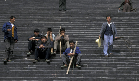 a worker at the city of wushan on the yangzee river near the three gorges valley up of the three gorges dam project in the province of hubei in china.のeditorial素材