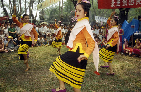 traditional dance at the spring and water festival near Jinghong in Xishuangbanna in the region of the province of Yunnan in China in east asia.のeditorial素材