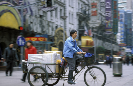 a bicycle transportation in the City of Shanghai in China in east asia.のeditorial素材