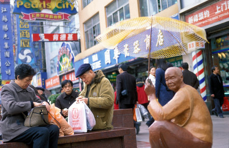 the Nanjing Dong Lu road in the City of Shanghai in China in east asia.