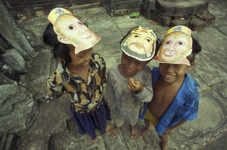 childern in a temple in Angkor at the town of Siem Reap in cambodia in Southeastasia.のeditorial素材