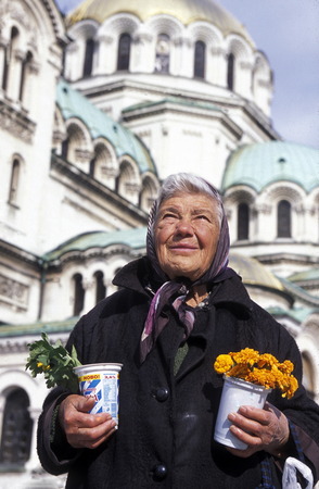 a women sales flowers at the Nevski church in the city of Sofia in Bulgaria in east Europe.のeditorial素材