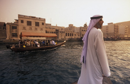 a city boat and ferry on the Dubai creek in the old town in the city of Dubai in the Arab Emirates in the Gulf of Arabia.のeditorial素材