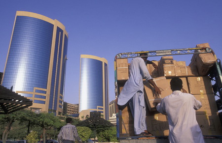 Import and export goods at the harbour at the Dubai creek in the old town in the city of Dubai in the Arab Emirates in the Gulf of Arabia.のeditorial素材