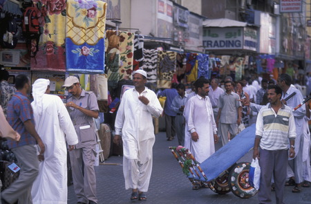 a shopping street in the souq or Market in the old town in the city of Dubai in the Arab Emirates in the Gulf of Arabia.のeditorial素材