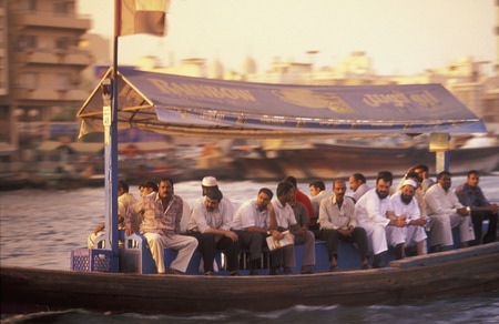 a city boat and ferry on the Dubai creek in the old town in the city of Dubai in the Arab Emirates in the Gulf of Arabia.のeditorial素材