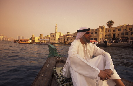 a city boat and ferry on the Dubai creek in the old town in the city of Dubai in the Arab Emirates in the Gulf of Arabia.のeditorial素材
