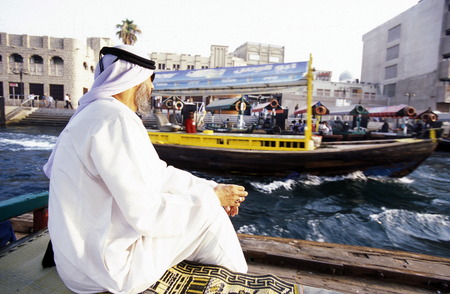 a city boat and ferry on the Dubai creek in the old town in the city of Dubai in the Arab Emirates in the Gulf of Arabia.のeditorial素材