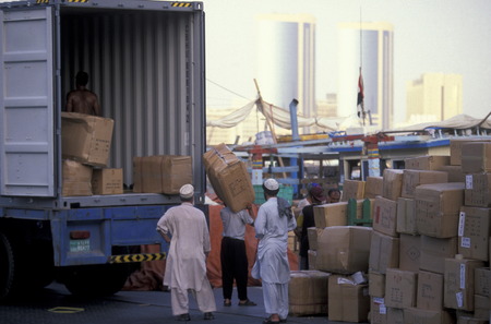 Import and export goods at the harbour at the Dubai creek in the old town in the city of Dubai in...