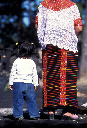 indio women at a religion ceremony in the old town in the city of Antigua in Guatemala in central America.のeditorial素材