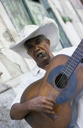 a signor with a cigar in the city of Santiago de Cuba on Cuba in the caribbean sea.のeditorial素材