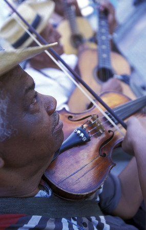 a salsa band in the city centre in the old Town of the Village of trinidad on Cuba in the caribbean sea.のeditorial素材
