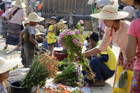People at the Market at the Village of Phaung Daw Oo at the Inle Lake in the Shan State in the east of Myanmar in Southeastasia.のeditorial素材