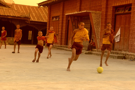 Young Monks Play Soccer in a Pagoda in the town of Nyaungshwe at the Inle Lake in the Shan State in the east of Myanmar in Southeastasia.のeditorial素材