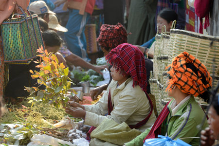 People at the Market at the Village of Phaung Daw Oo at the Inle Lake in the Shan State in the east of Myanmar in Southeastasia.のeditorial素材