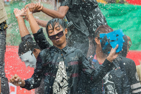 People at the Waterparty at the Thingyan Water Festival at the Myanmar New Year in the city centre...