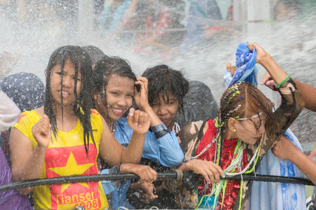 People at the Waterparty at the Thingyan Water Festival at the Myanmar New Year in the city centre...
