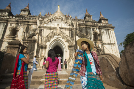 Tourists in front of a big Temple and Pagoda Fields in Bagan in Myanmar in Southeastasia.のeditorial素材