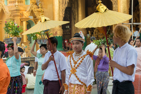 people on a ceremony at the Shwedagon Paya Pagoda in the City of Yangon in Myanmar in Southeastasia.