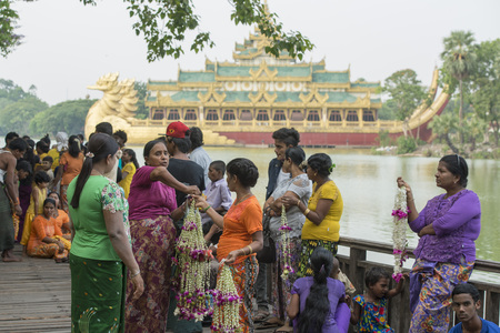 people in front of the Restaurant Karaweik on the Kandawgyi lake in the City of Yangon in Myanmar in Southeastasia.のeditorial素材