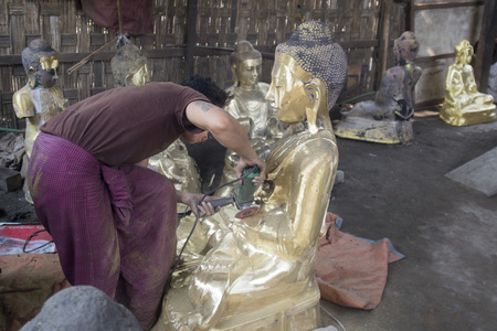 a Bronce Buddha sculpture production in the City of Mandalay in Myanmar in Southeastasia.のeditorial素材
