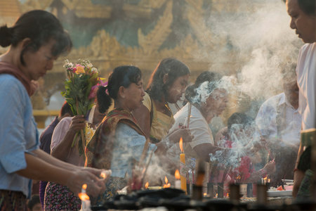 people on a ceremony at the Shwedagon Paya Pagoda in the City of Yangon in Myanmar in Southeastasia.
