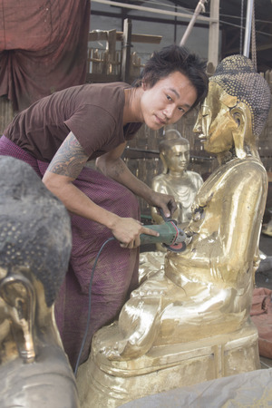 a Bronce Buddha sculpture production in the City of Mandalay in Myanmar in Southeastasia.のeditorial素材