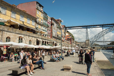 the Ponte de Dom Luis 1 at the old town on the Douro River in Ribeira in the city centre of Porto in...