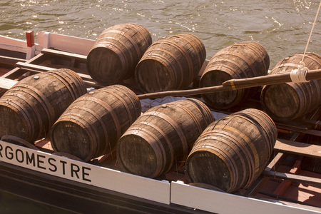 the port wine Boats at the waterfront with the old town on the Douro River in Ribeira in the city centre of Porto in Porugal in Europe.のeditorial素材