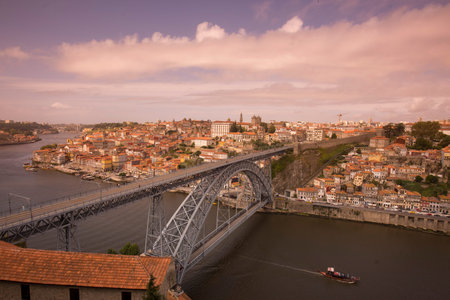 the Ponte de Dom Luis 1 at the old town on the Douro River in Ribeira in the city centre of Porto in...