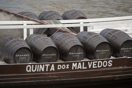 the port wine Boats at the waterfront with the old town on the Douro River in Ribeira in the city...
