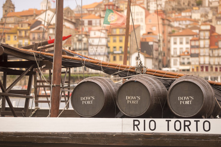 the port wine Boats at the waterfront with the old town on the Douro River in Ribeira in the city centre of Porto in Porugal in Europe.のeditorial素材